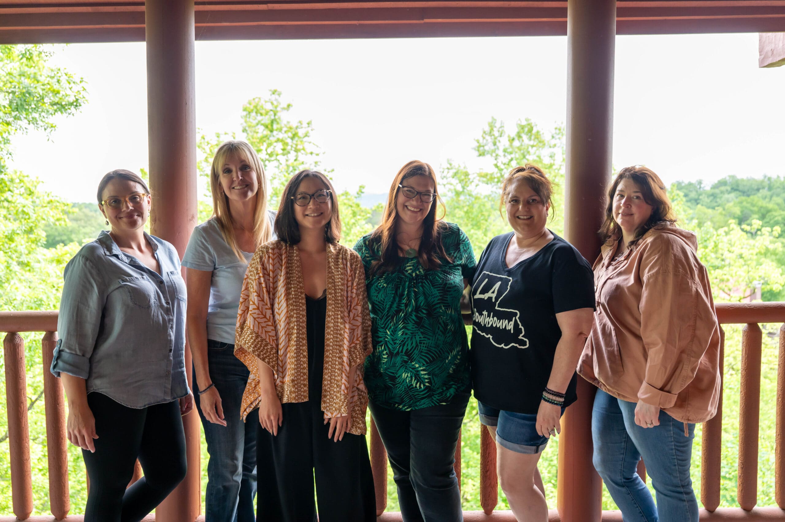 Smiling on the balcony of the Sound Waves Heal Retreat